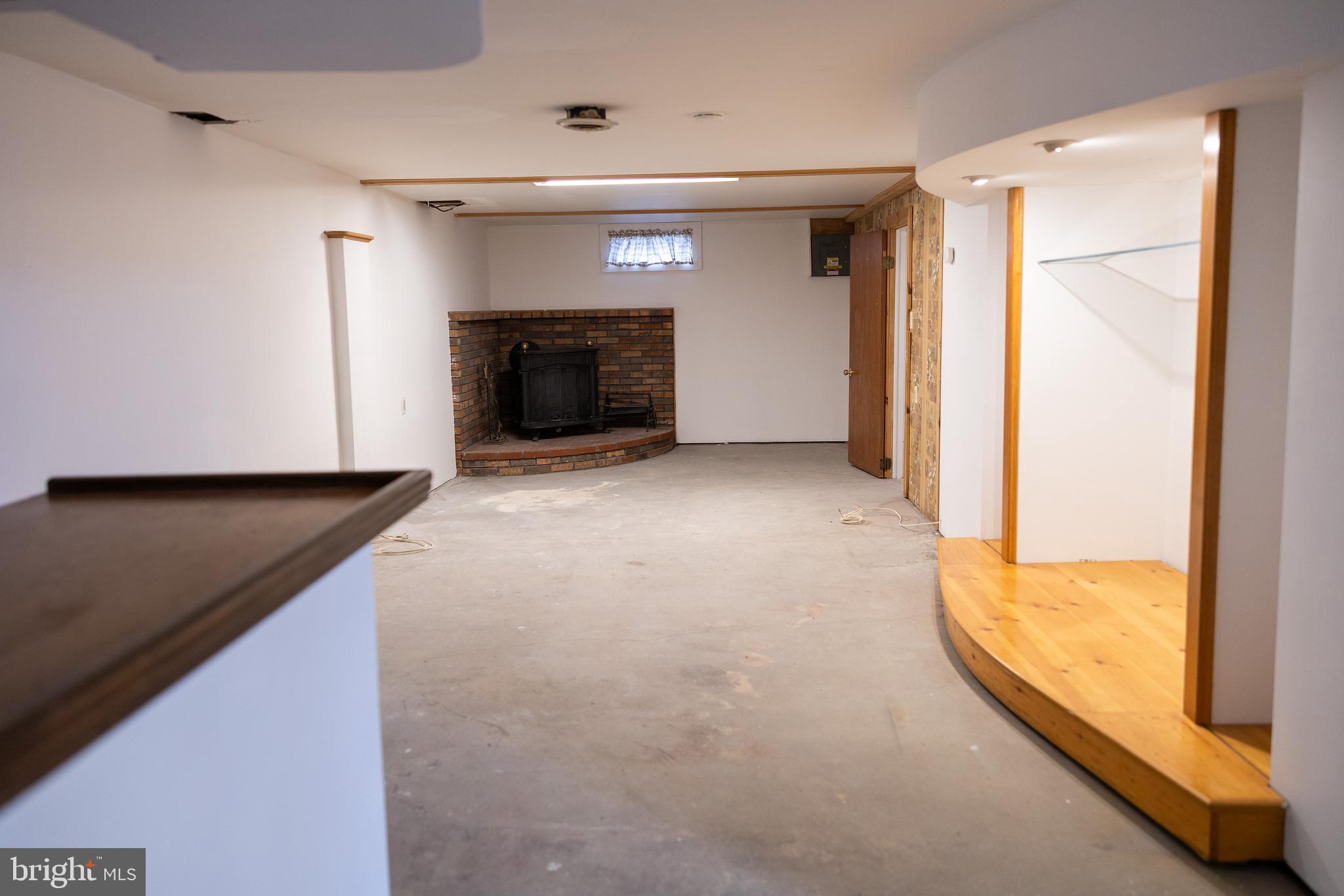 118 Grandview Drive Bridgeton, NJ 08302 - Photo 26 of 46 a view of an empty room and a fireplace