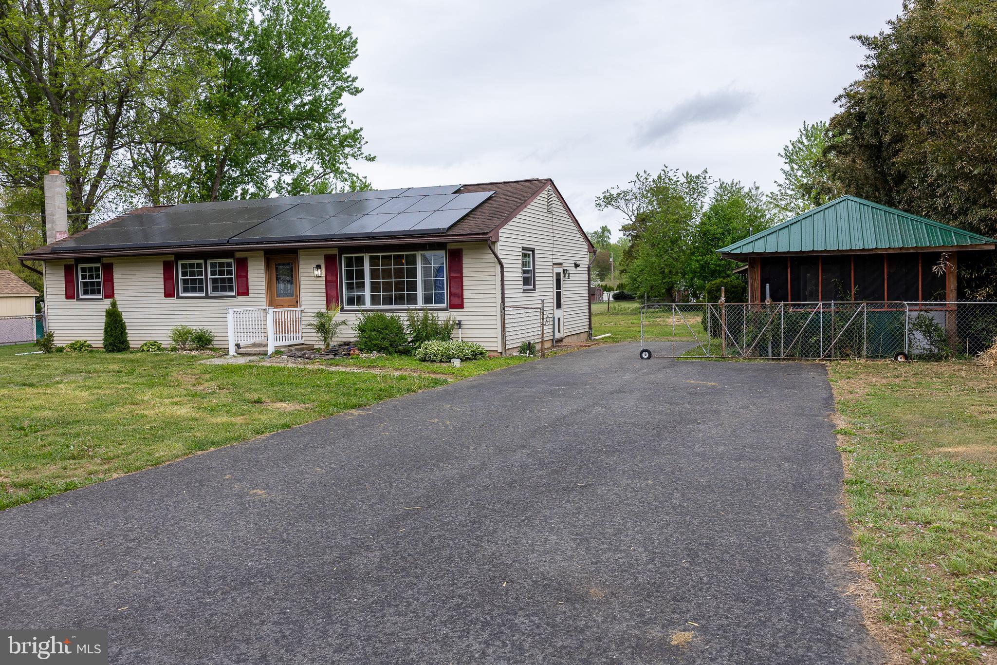 118 Grandview Drive Bridgeton, NJ 08302 - Photo 4 of 46 a front view of a house with a yard and garage