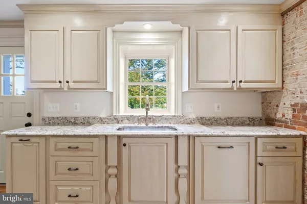a view of hallway with wooden floor