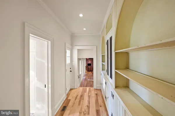 a bathroom with a granite countertop sink and a window