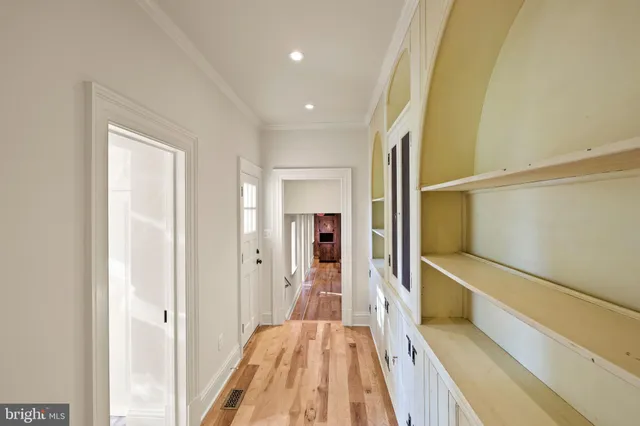 a bathroom with a granite countertop sink and a window