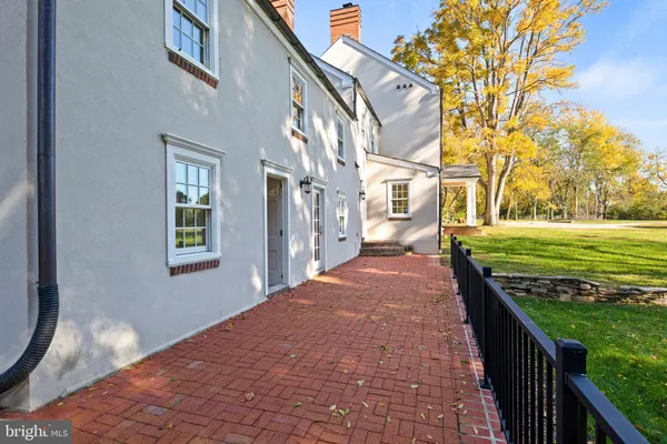 a bathroom with a granite countertop toilet sink and shower