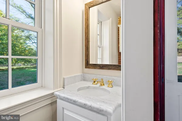 a bathroom with a sink a bathtub and a shower