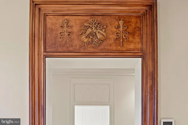 a bathroom with a granite countertop sink a mirror and shower