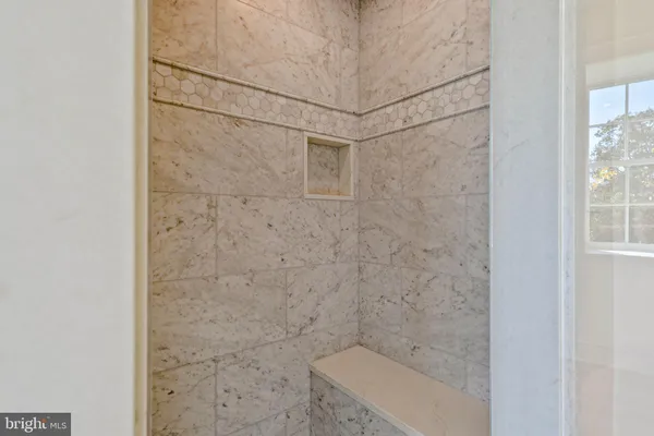 a view of a house with backyard and a tree