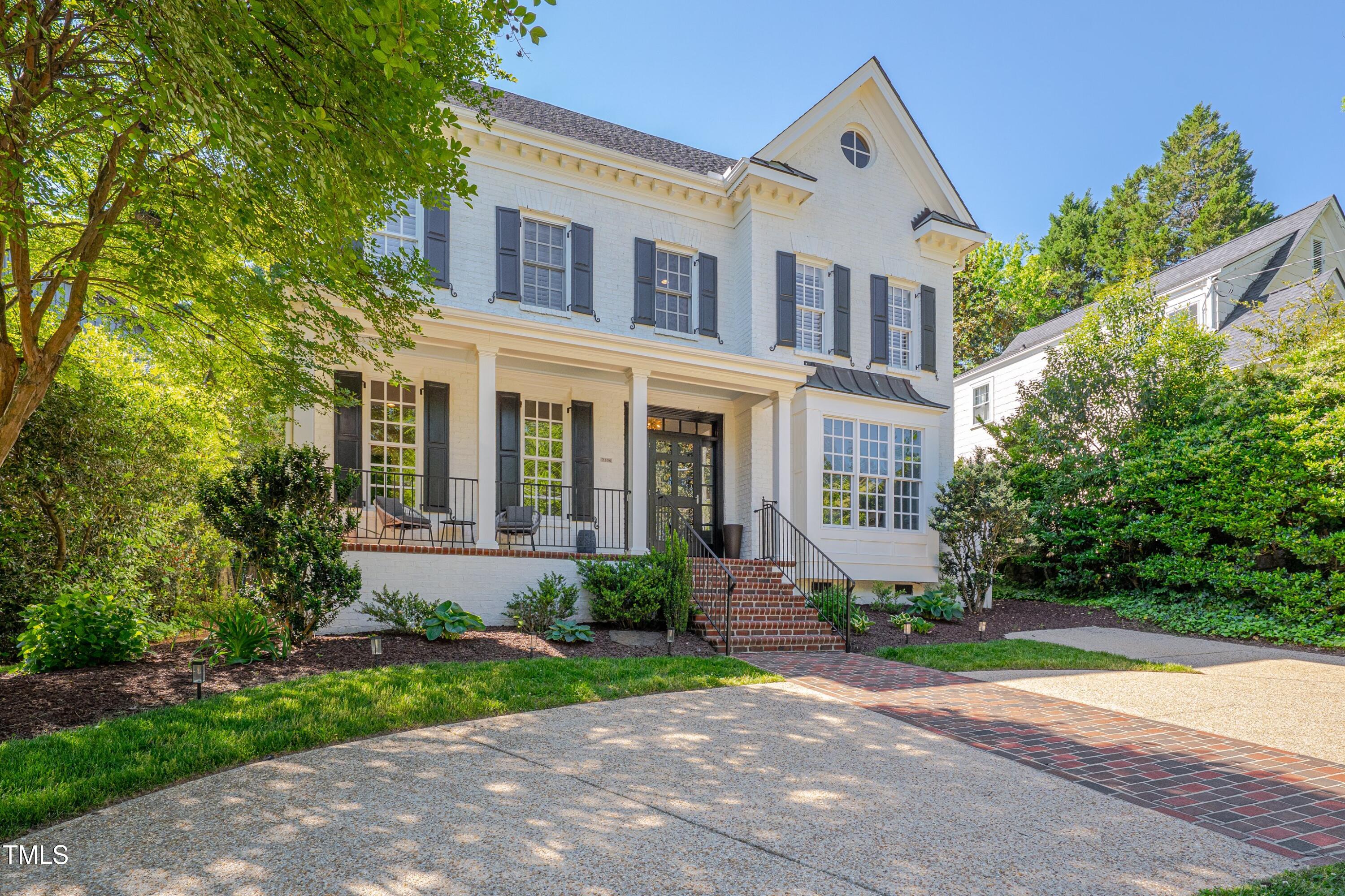 2306 Byrd Street Raleigh, NC 27608 - Photo 1 of 60 a front view of a house with yard and green space