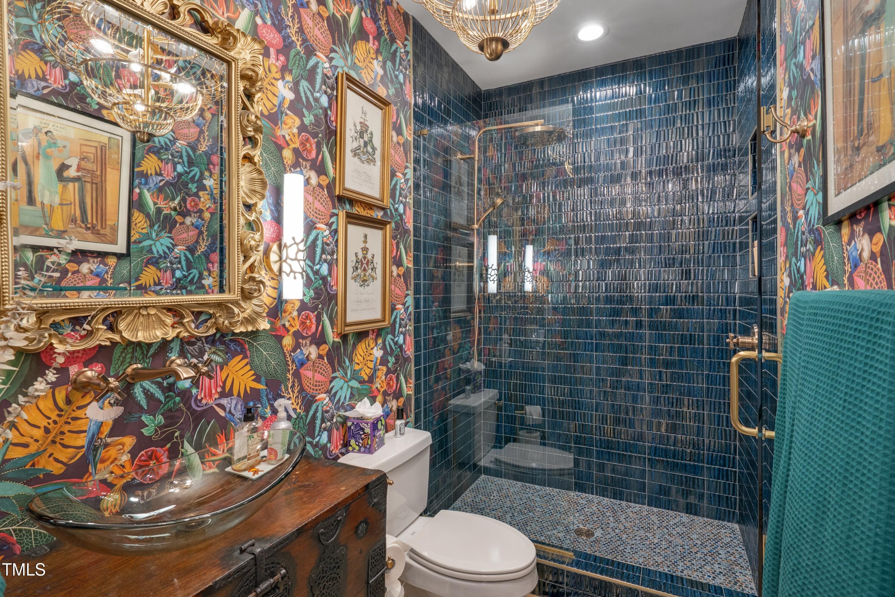 2306 Byrd Street Raleigh, NC 27608 - Photo 10 of 60 a bathroom with a toilet and shower curtain