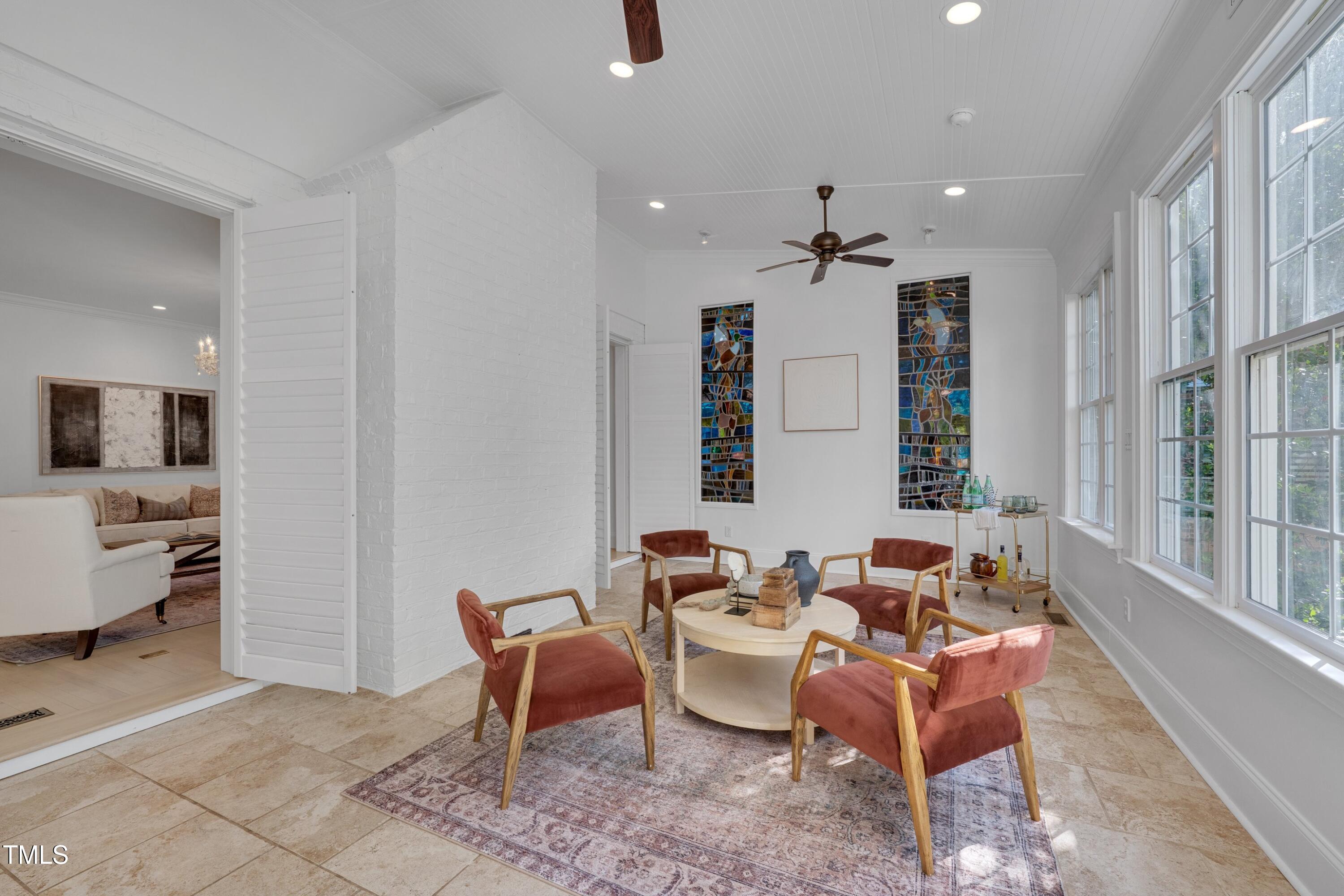2306 Byrd Street Raleigh, NC 27608 - Photo 17 of 60 a dining room with furniture and a chandelier