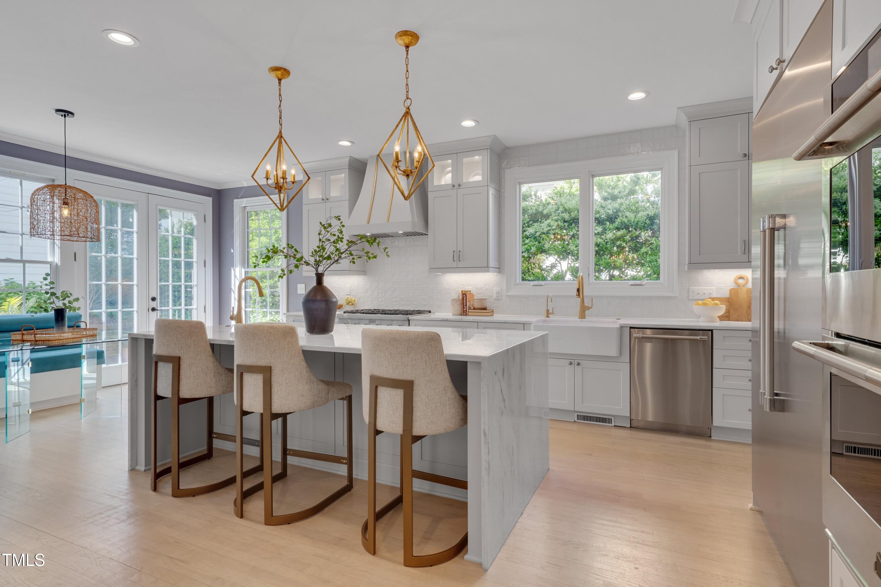 2306 Byrd Street Raleigh, NC 27608 - Photo 19 of 60 a kitchen with sink cabinets and outdoor dining space