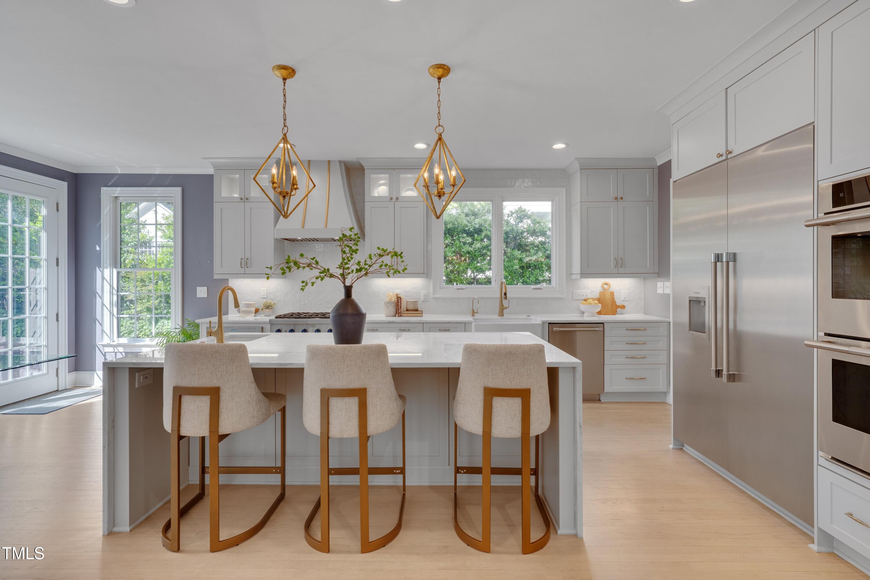 2306 Byrd Street Raleigh, NC 27608 - Photo 20 of 60 a dining room with furniture a chandelier and kitchen view