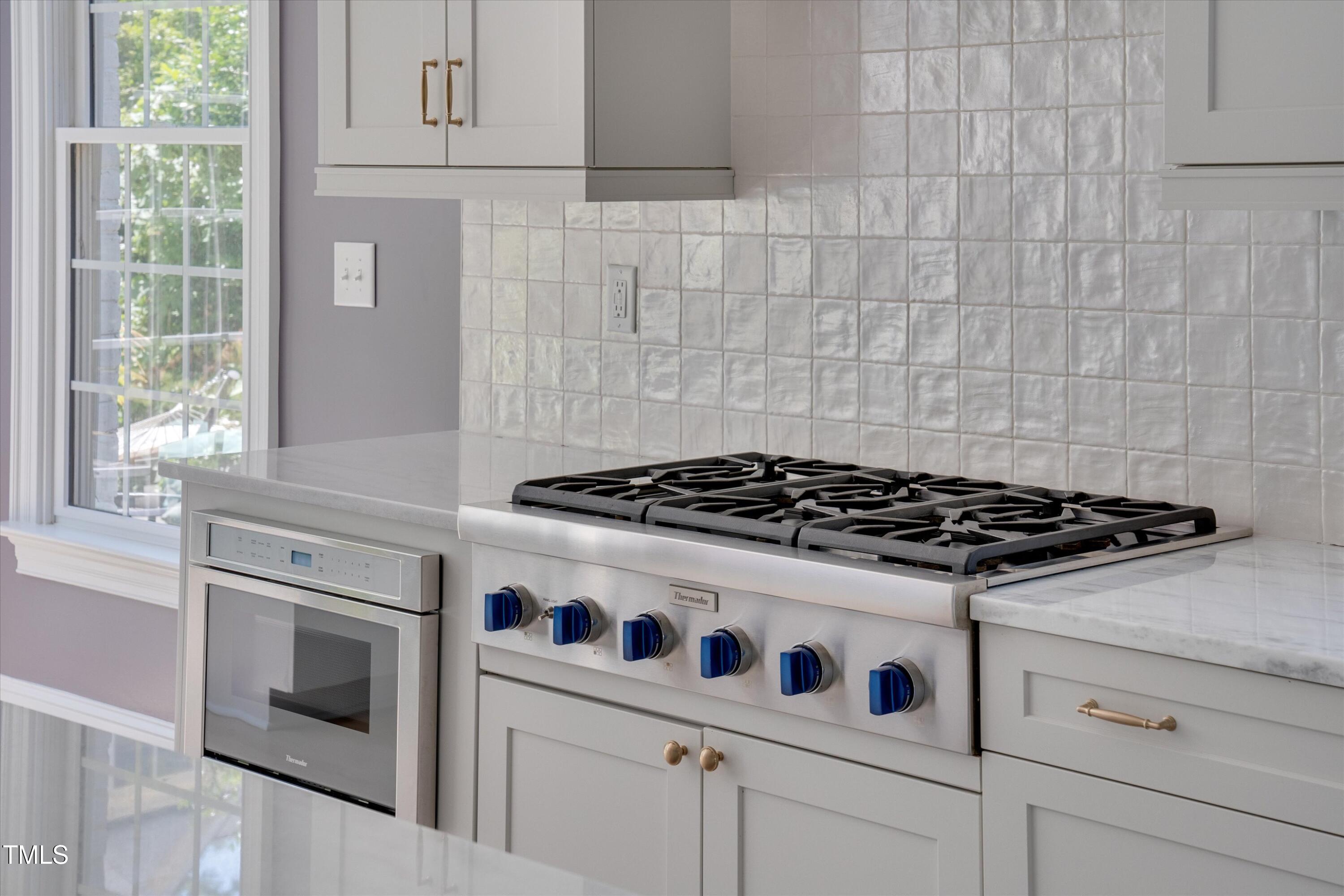 2306 Byrd Street Raleigh, NC 27608 - Photo 23 of 60 a stove top oven sitting inside of a kitchen