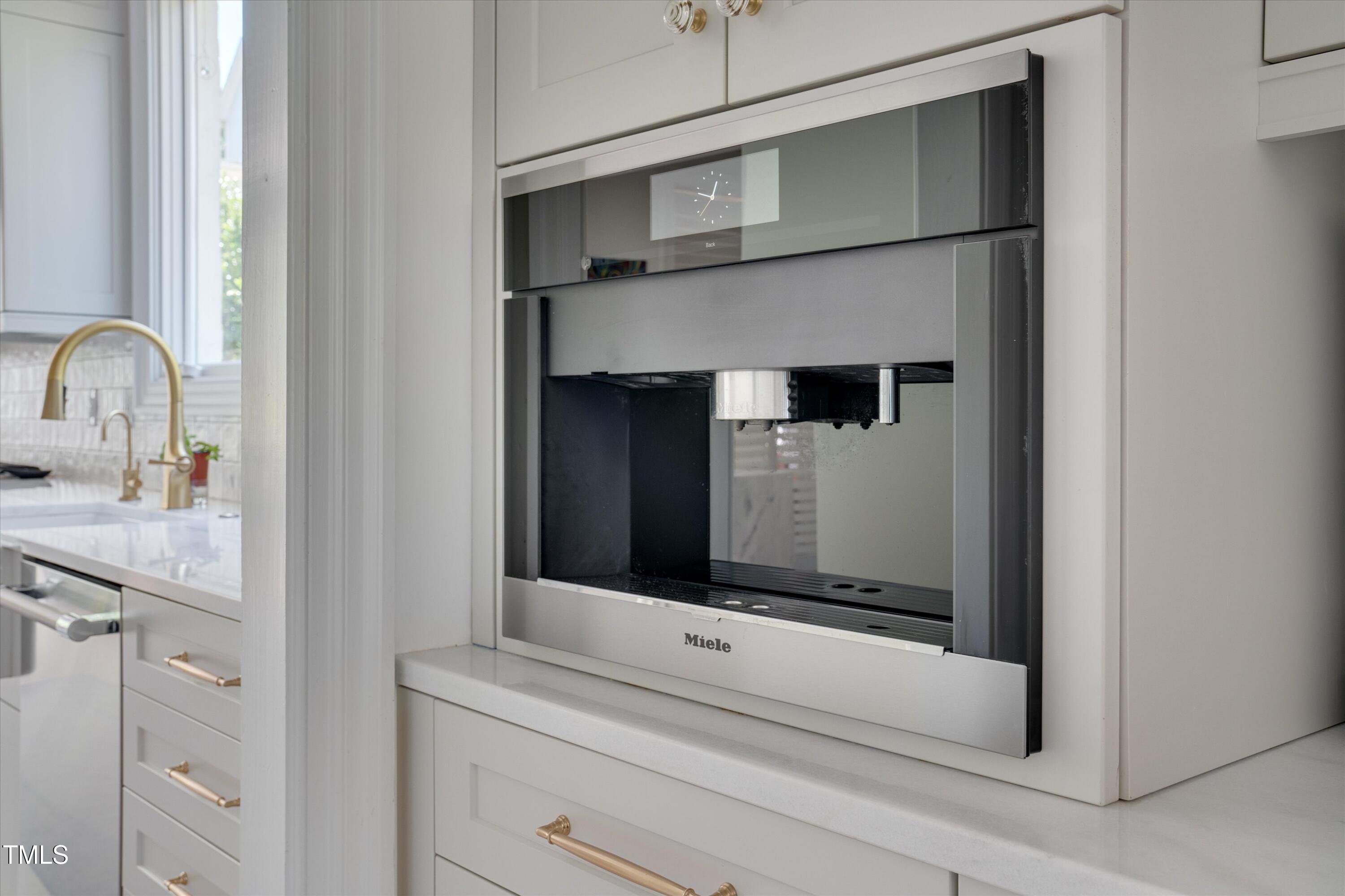 2306 Byrd Street Raleigh, NC 27608 - Photo 31 of 60 a bathroom with a sink and a mirror