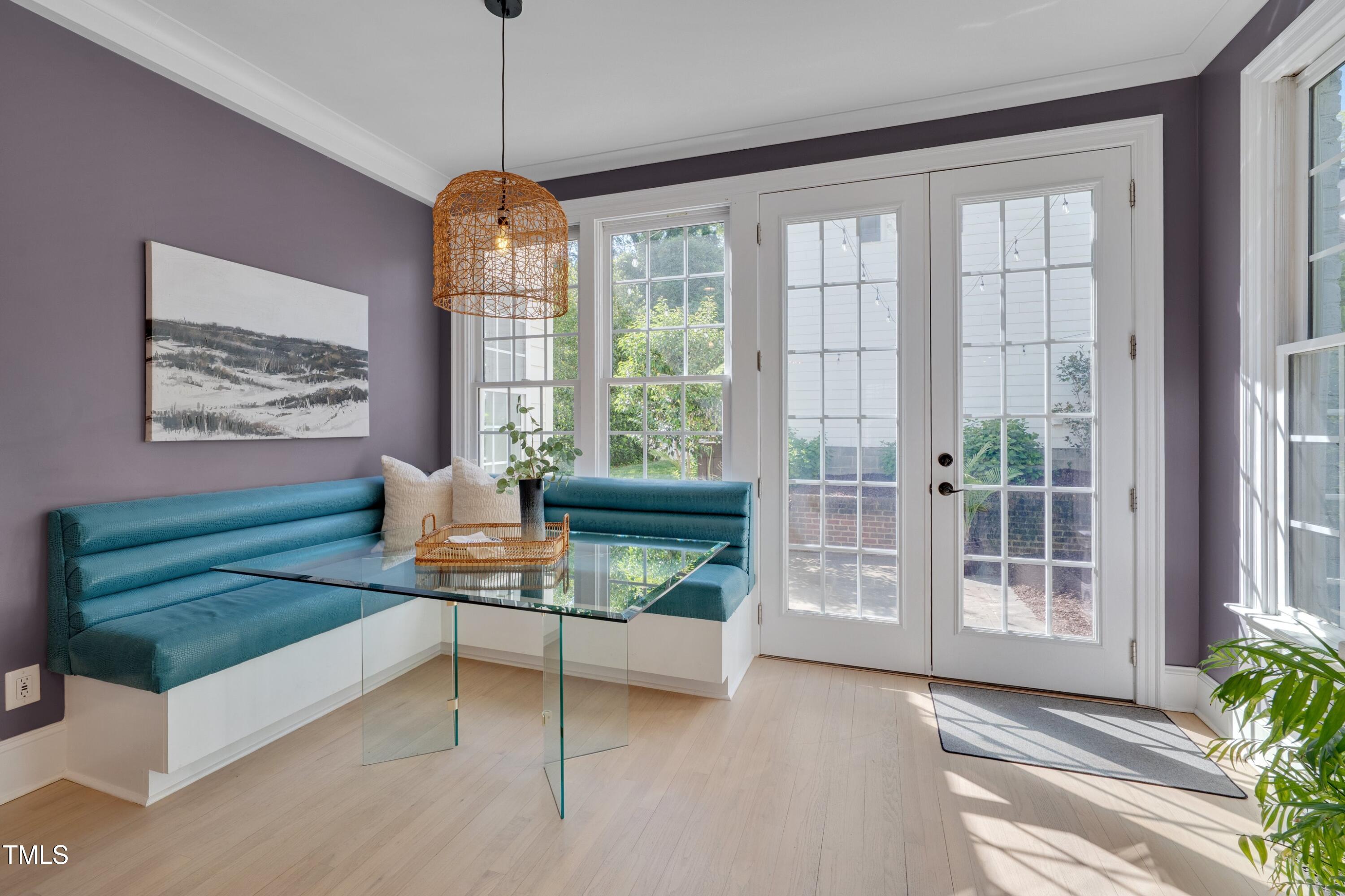 2306 Byrd Street Raleigh, NC 27608 - Photo 32 of 60 a living room with furniture and a chandelier