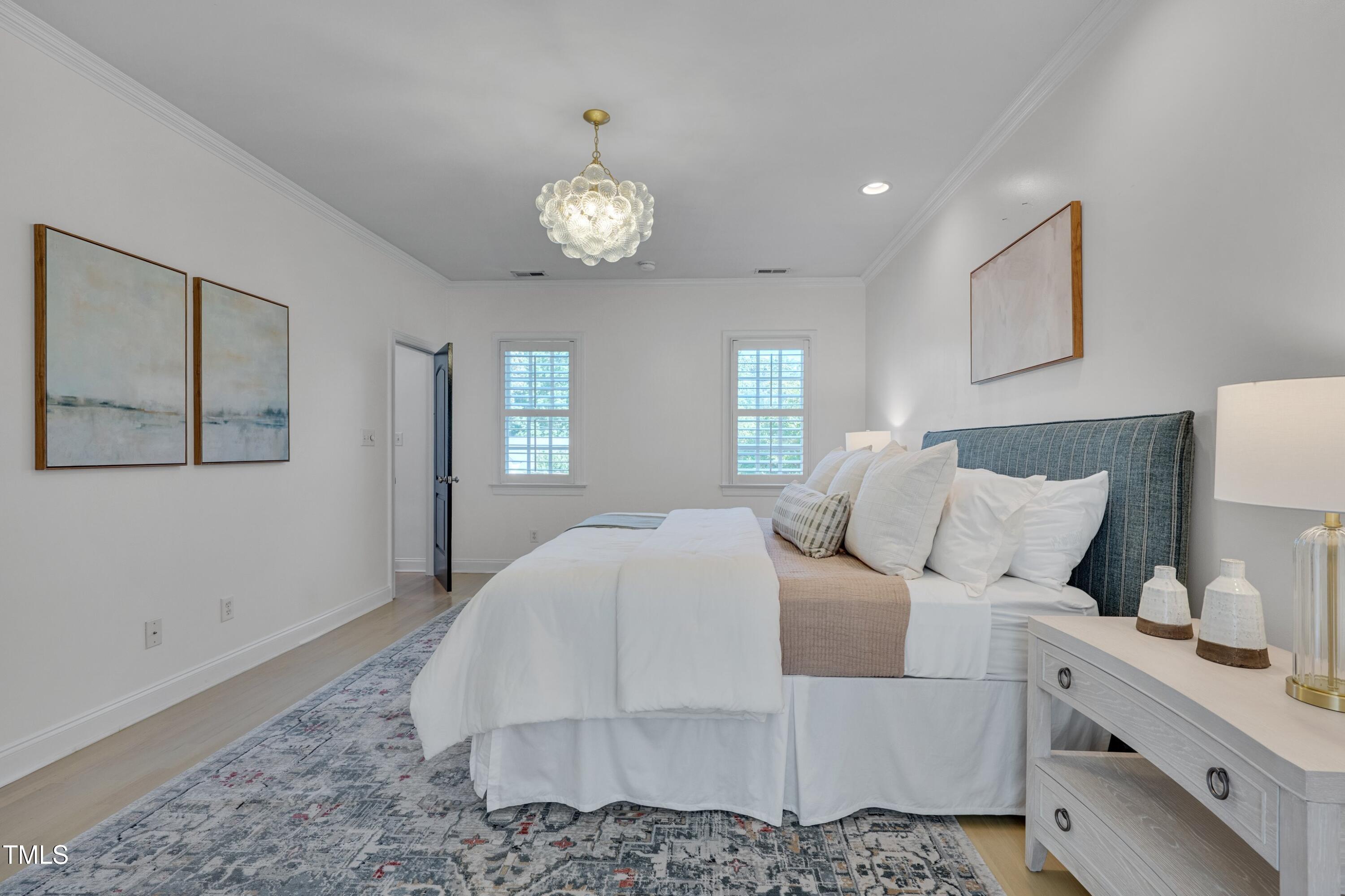 2306 Byrd Street Raleigh, NC 27608 - Photo 34 of 60 a bedroom with a large bed and a window