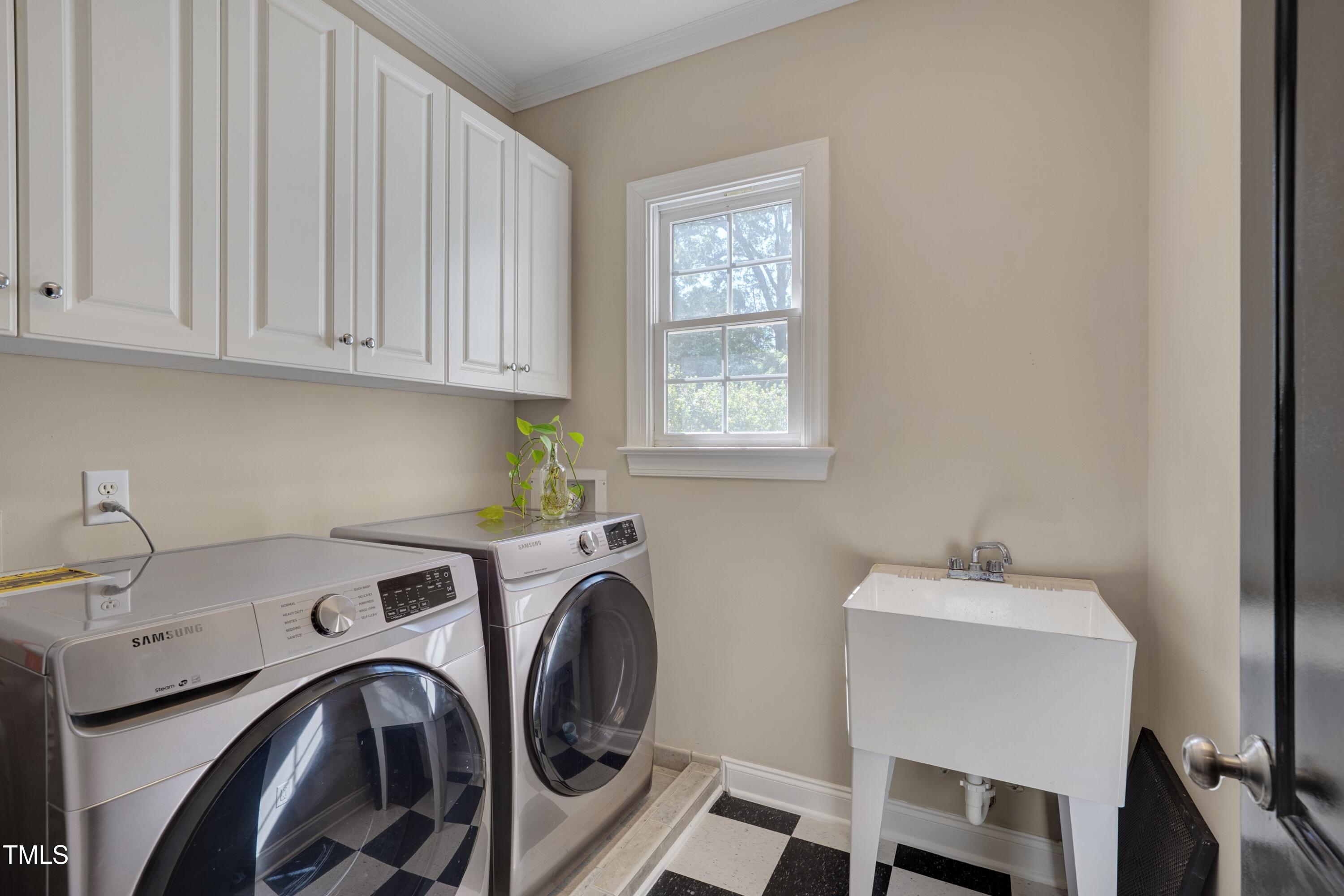 2306 Byrd Street Raleigh, NC 27608 - Photo 38 of 60 a utility room with dryer and washer