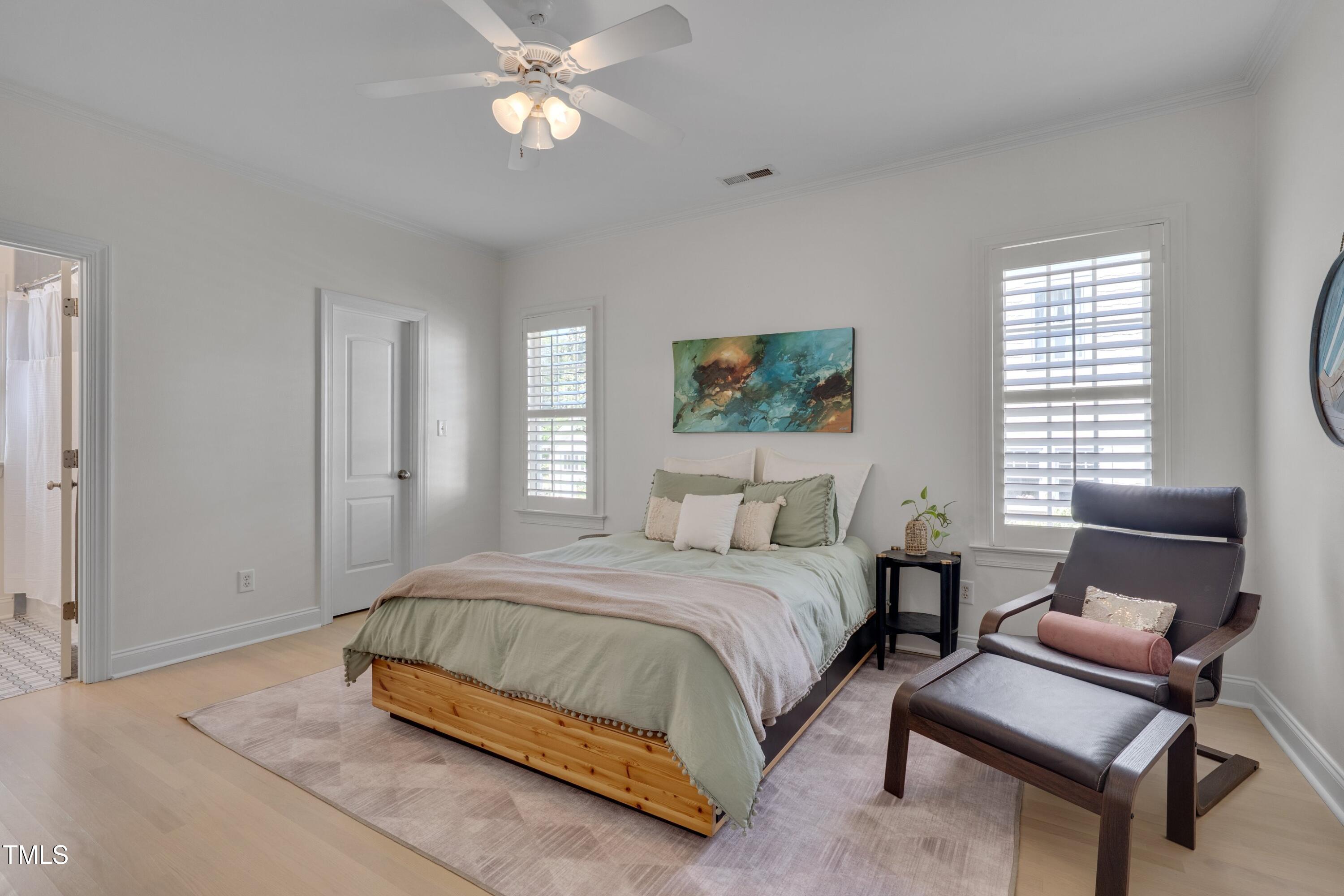 2306 Byrd Street Raleigh, NC 27608 - Photo 39 of 60 a bedroom with a bed and a couch