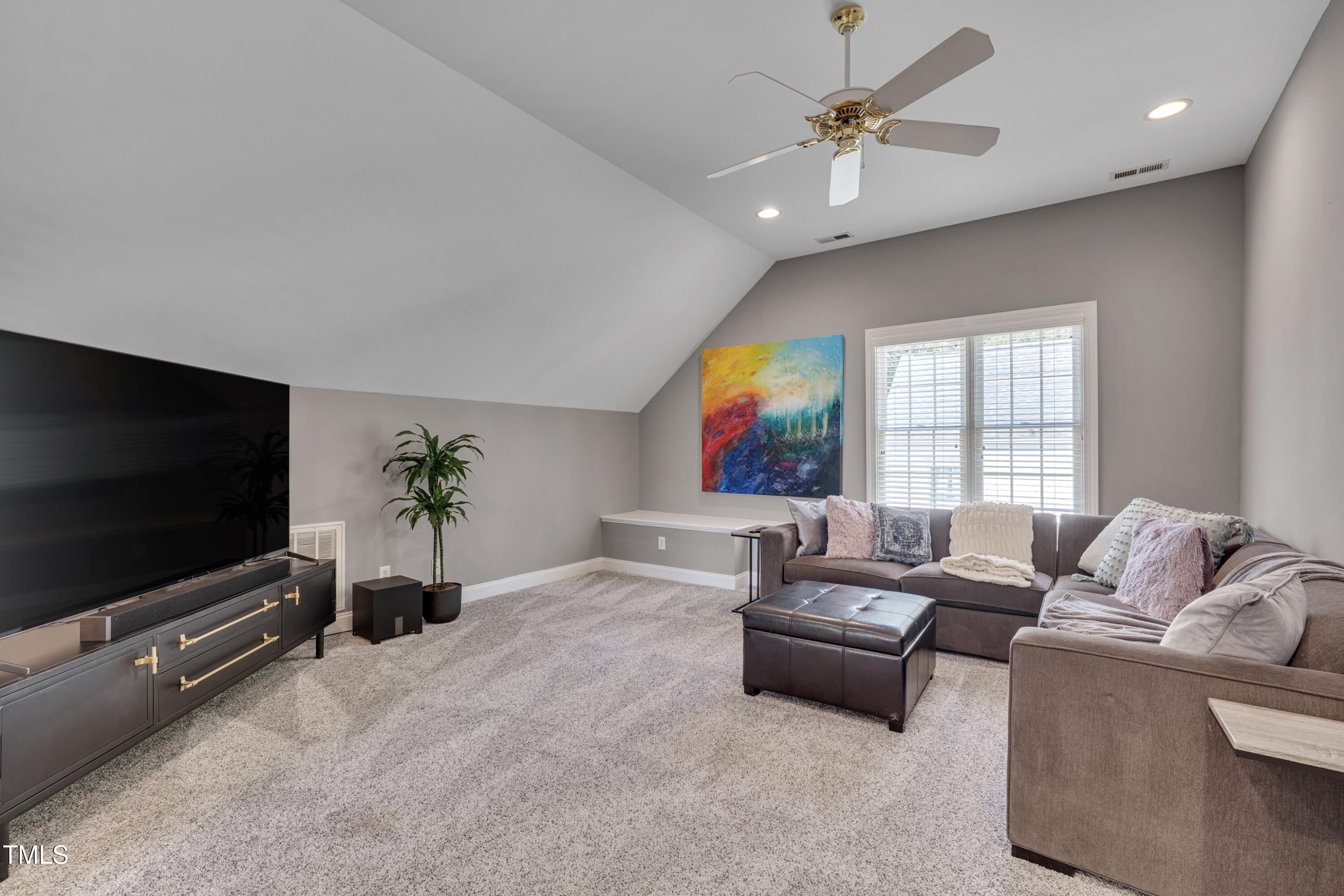 2306 Byrd Street Raleigh, NC 27608 - Photo 44 of 60 a living room with furniture and a flat screen tv