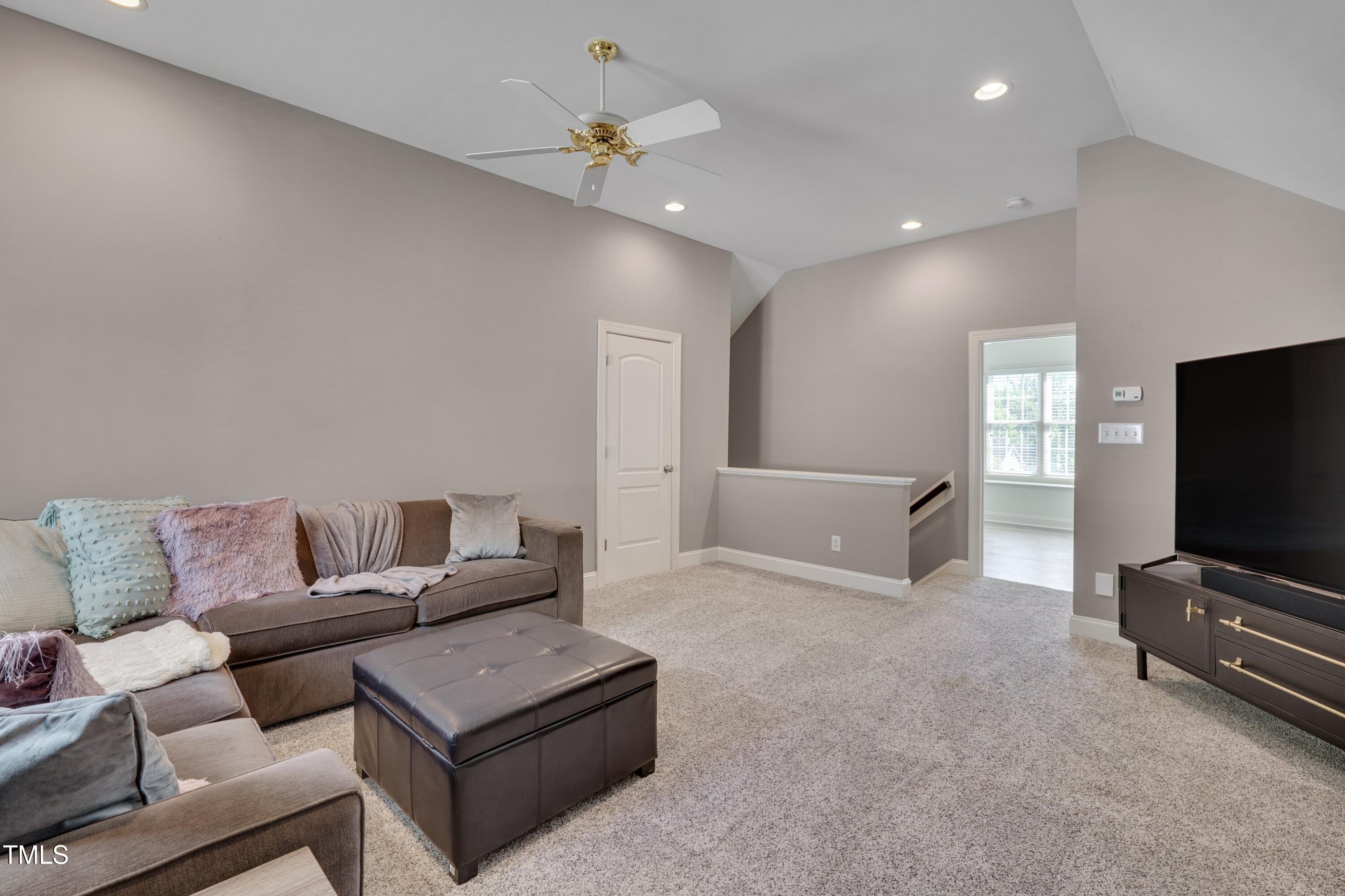 2306 Byrd Street Raleigh, NC 27608 - Photo 45 of 60 a living room with furniture and a flat screen tv