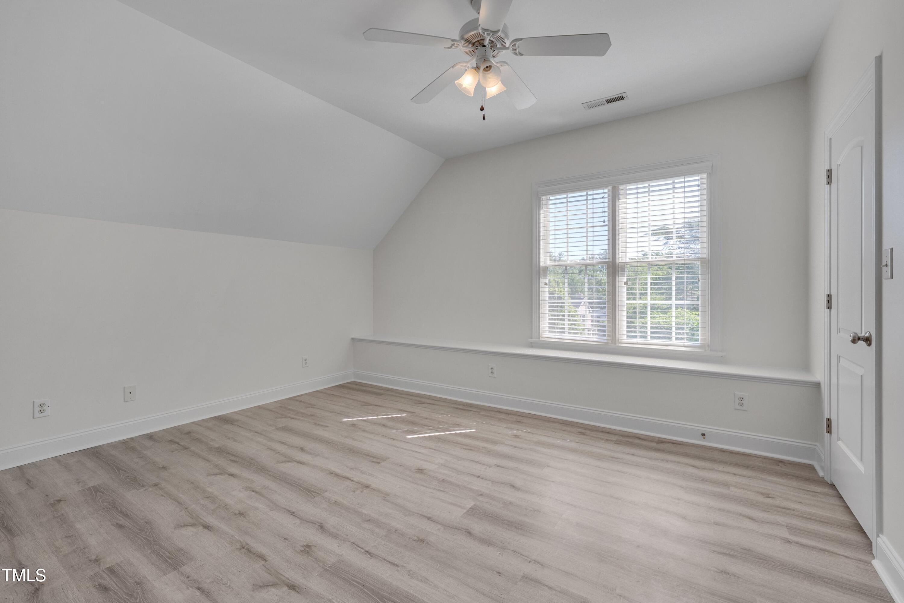2306 Byrd Street Raleigh, NC 27608 - Photo 46 of 60 wooden floor in an empty room with a window
