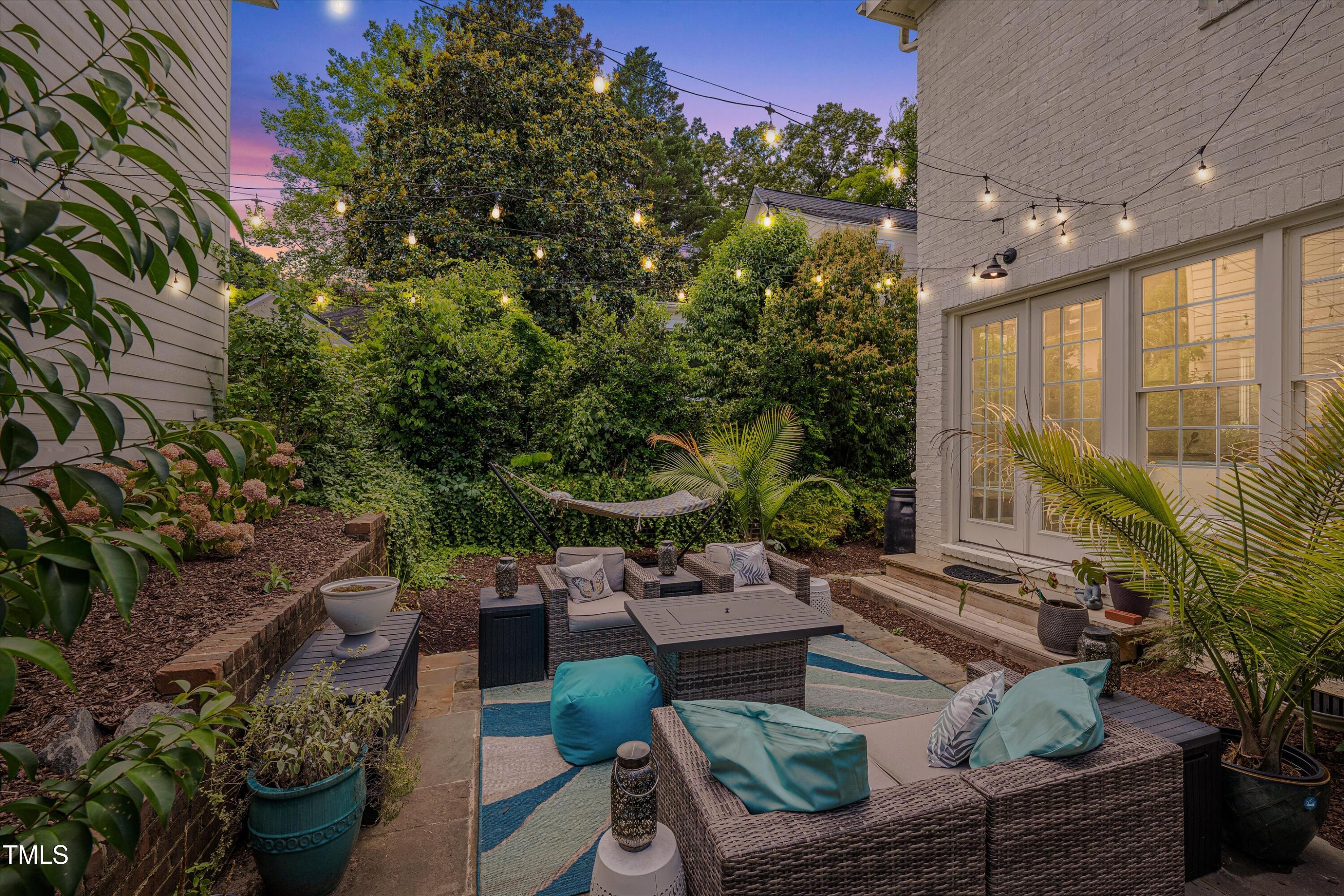 2306 Byrd Street Raleigh, NC 27608 - Photo 51 of 60 a view of a patio with couches table and chairs and potted plants