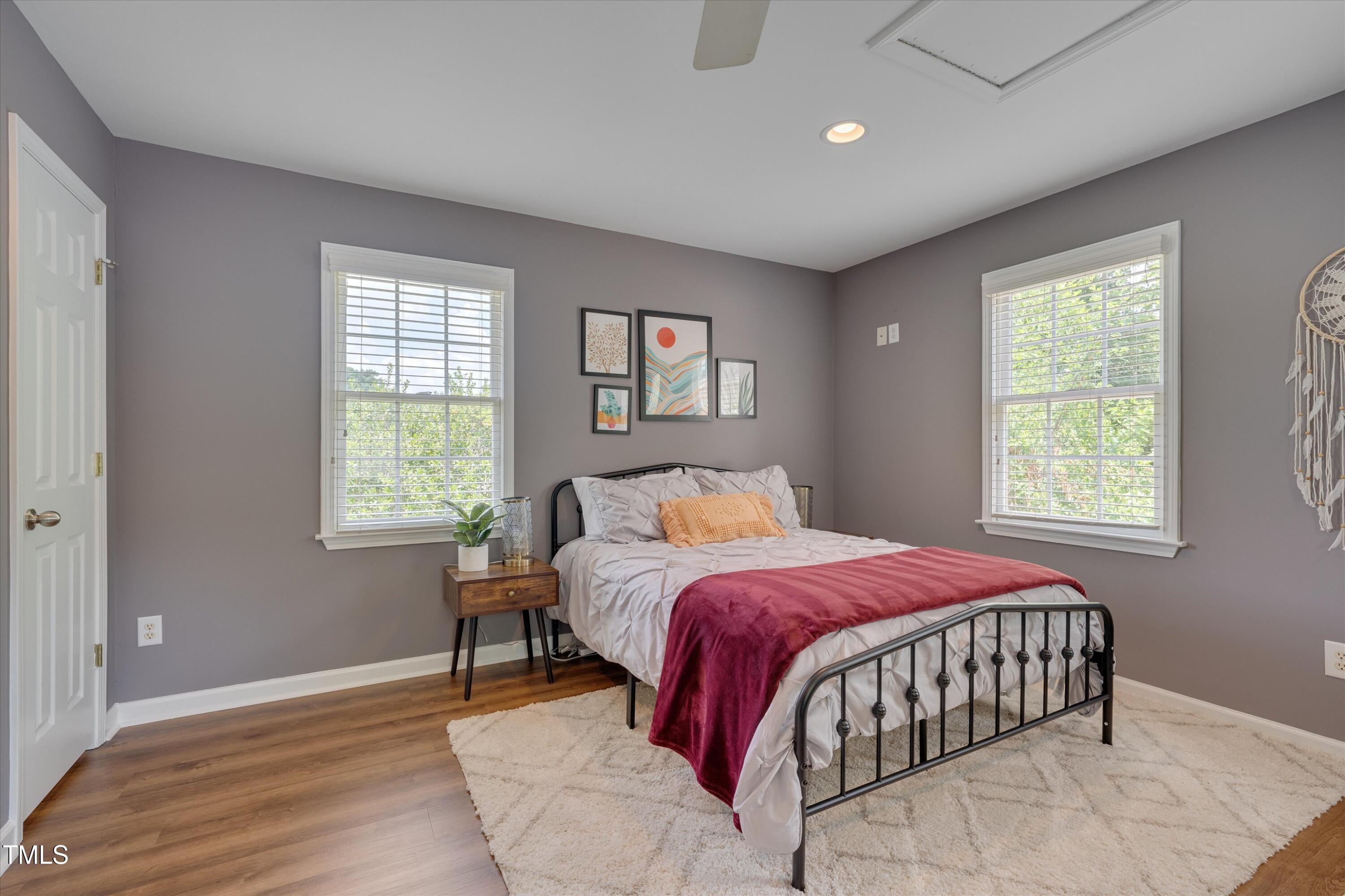 2306 Byrd Street Raleigh, NC 27608 - Photo 53 of 60 a bedroom with a bed and wooden floor