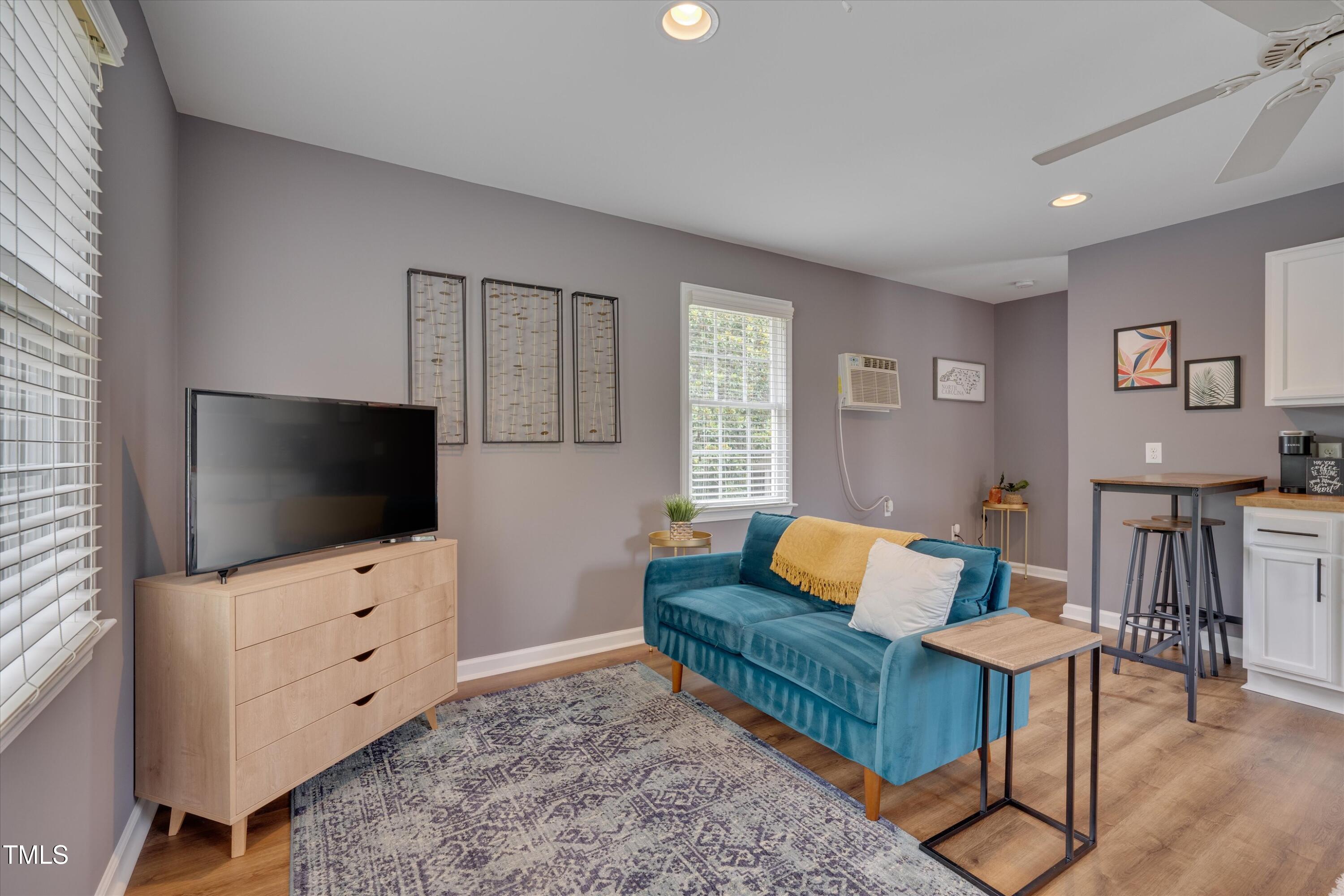2306 Byrd Street Raleigh, NC 27608 - Photo 54 of 60 a living room with furniture and a flat screen tv