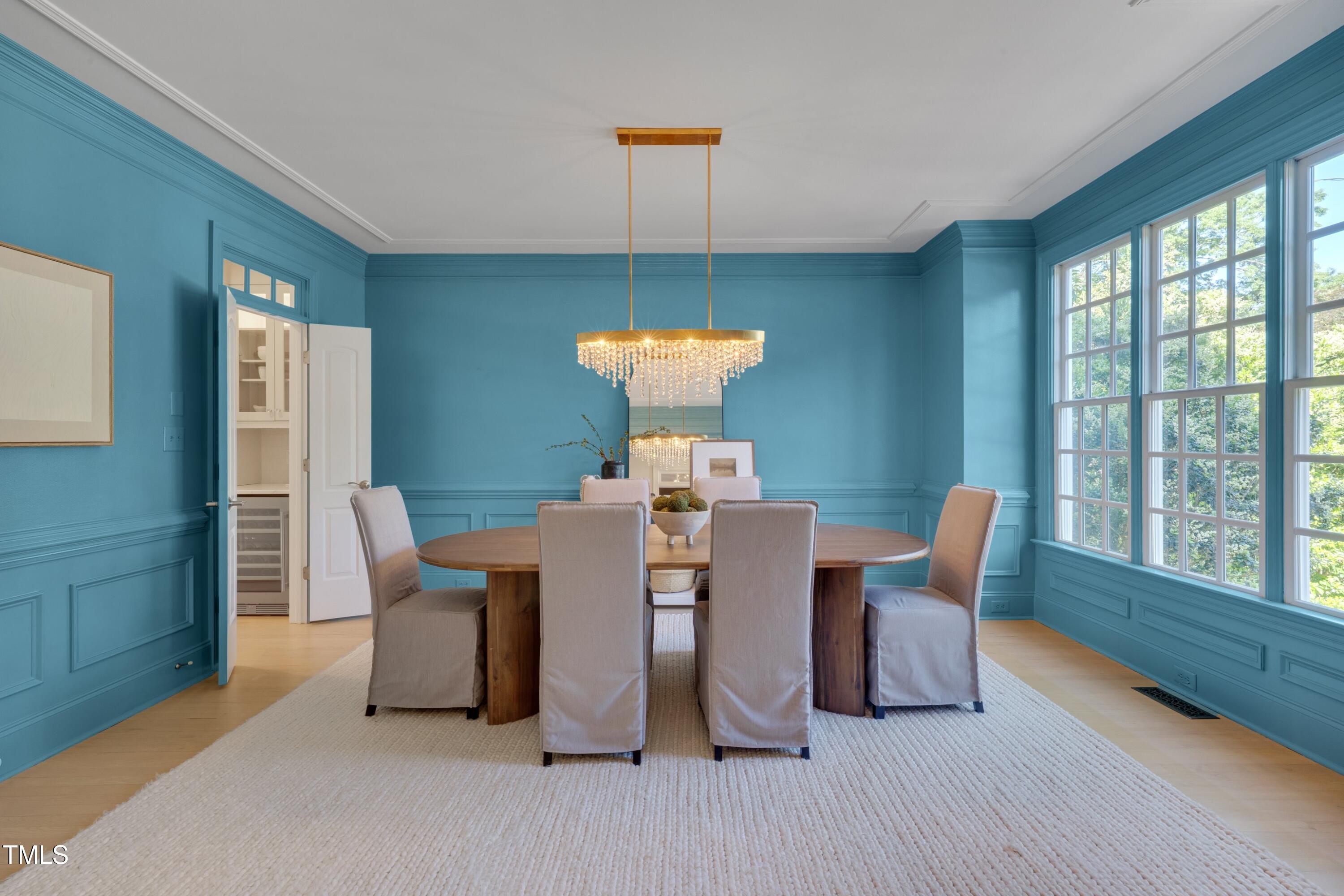 2306 Byrd Street Raleigh, NC 27608 - Photo 6 of 60 a dining room with furniture a chandelier and wooden floor