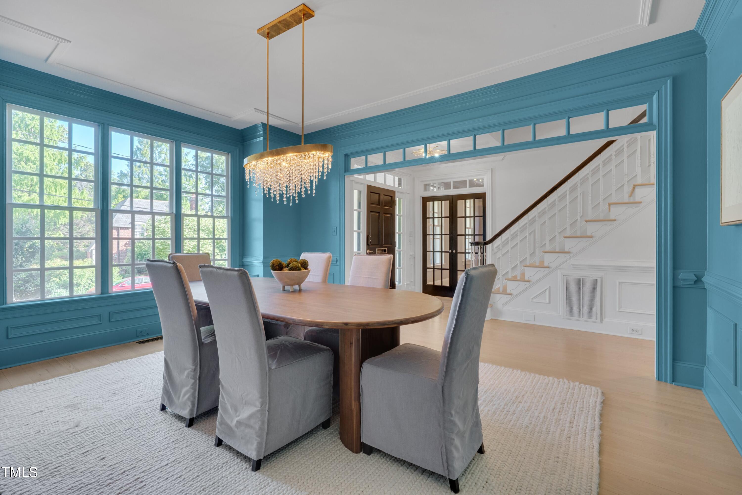 2306 Byrd Street Raleigh, NC 27608 - Photo 7 of 60 a dining room with furniture window and wooden floor