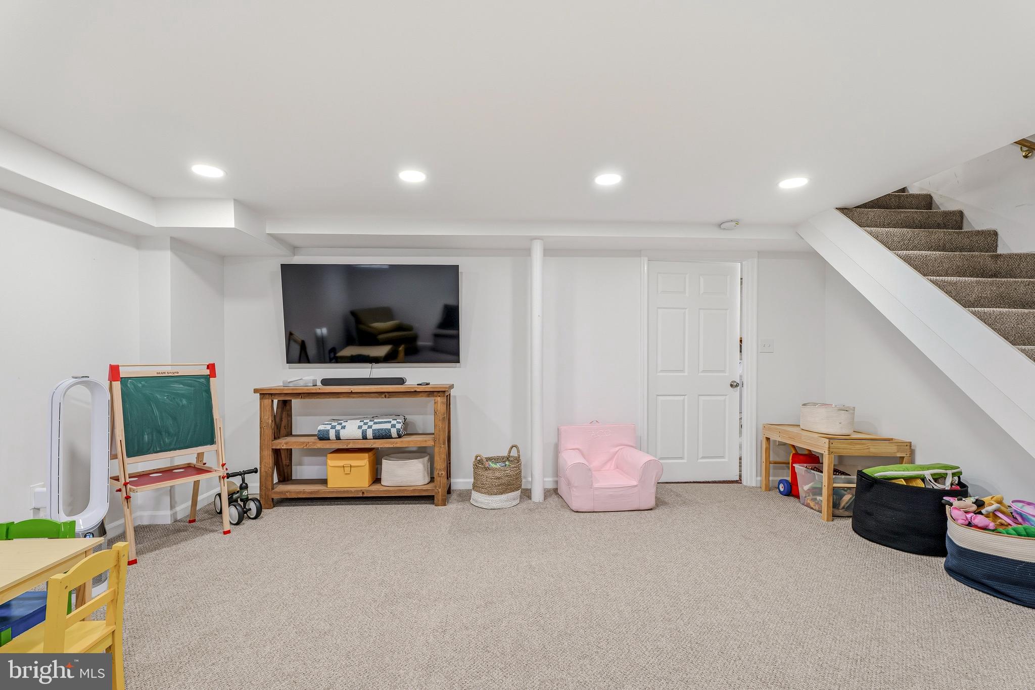 314 Murdock Road Baltimore, MD 21212 - Photo 29 of 42 a living room with furniture and a flat screen tv