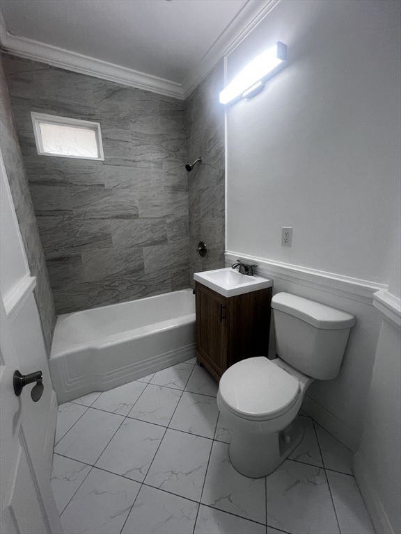 19 Reeves Street Worcester, MA 01607 - Photo 20 of 30 a bathroom with a toilet a sink and bathtub