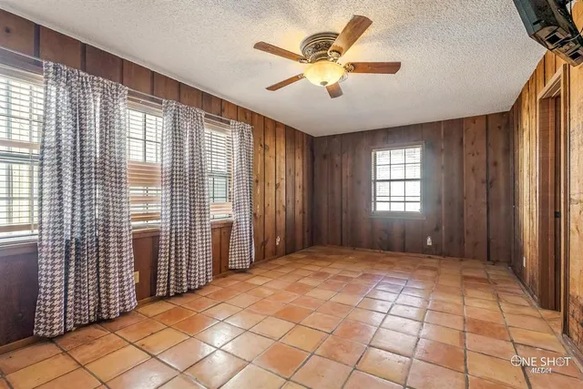 a bathroom with a granite countertop sink and a stove