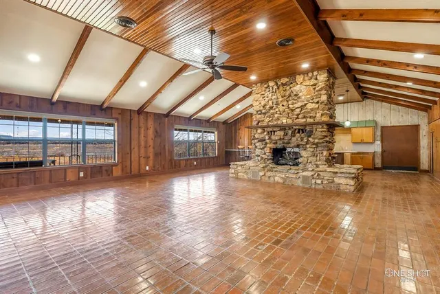 a view of living room with furniture and a chandelier