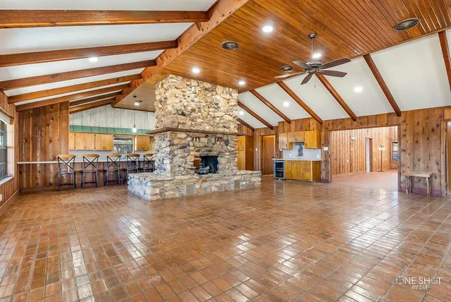 a view of an empty room with windows