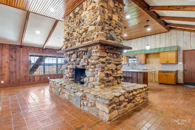 a kitchen with a sink a counter top space and stainless steel appliances