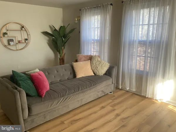 a living room with furniture and window