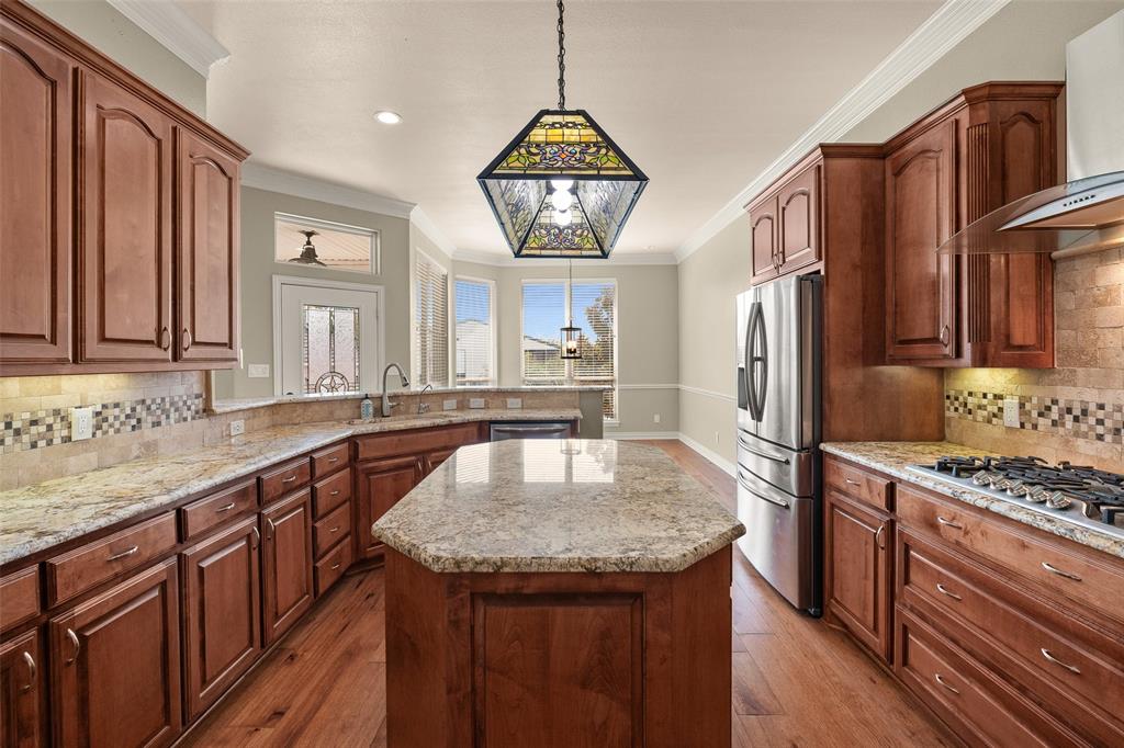 167 Duke Trail Weatherford, TX 76088 - Photo 12 of 40 a kitchen with granite countertop a sink a counter space appliances and cabinets