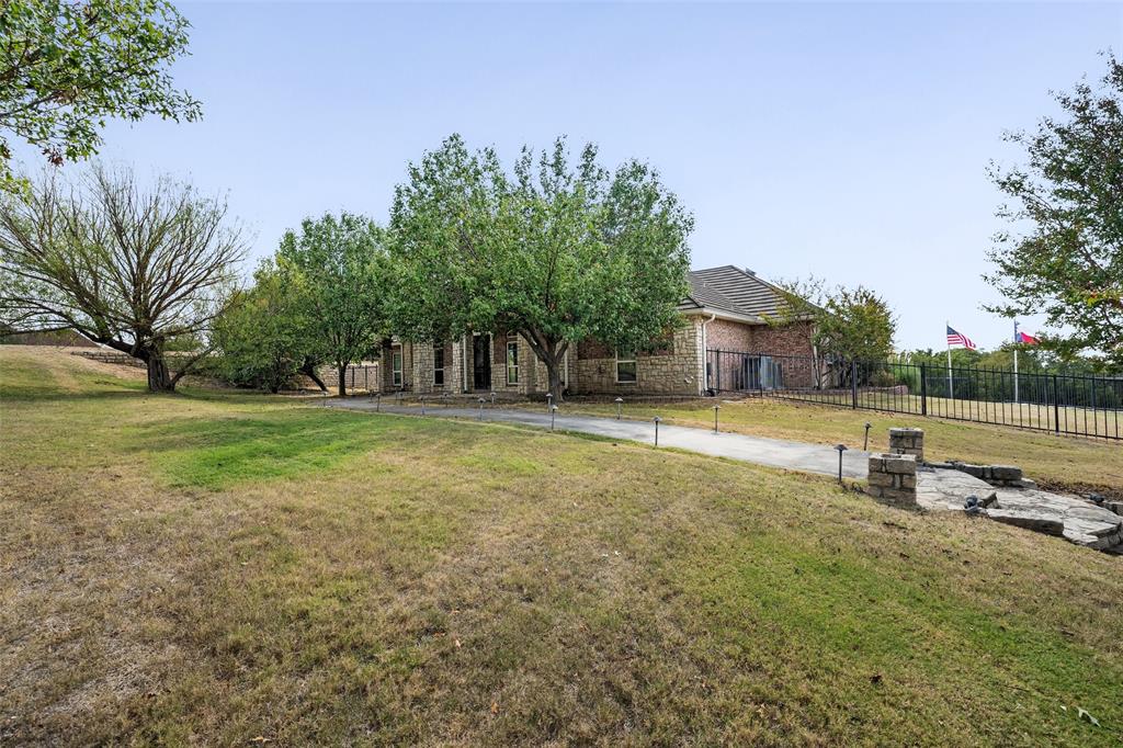 167 Duke Trail Weatherford, TX 76088 - Photo 2 of 40 a view of a swimming pool with a yard