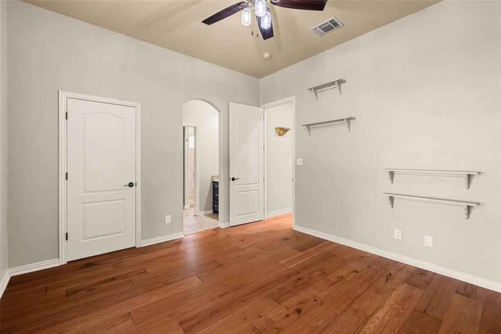 167 Duke Trail Weatherford, TX 76088 - Photo 23 of 40 a view of an empty room with wooden floor