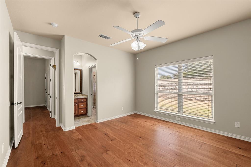 167 Duke Trail Weatherford, TX 76088 - Photo 24 of 40 wooden floor in an empty room with a window