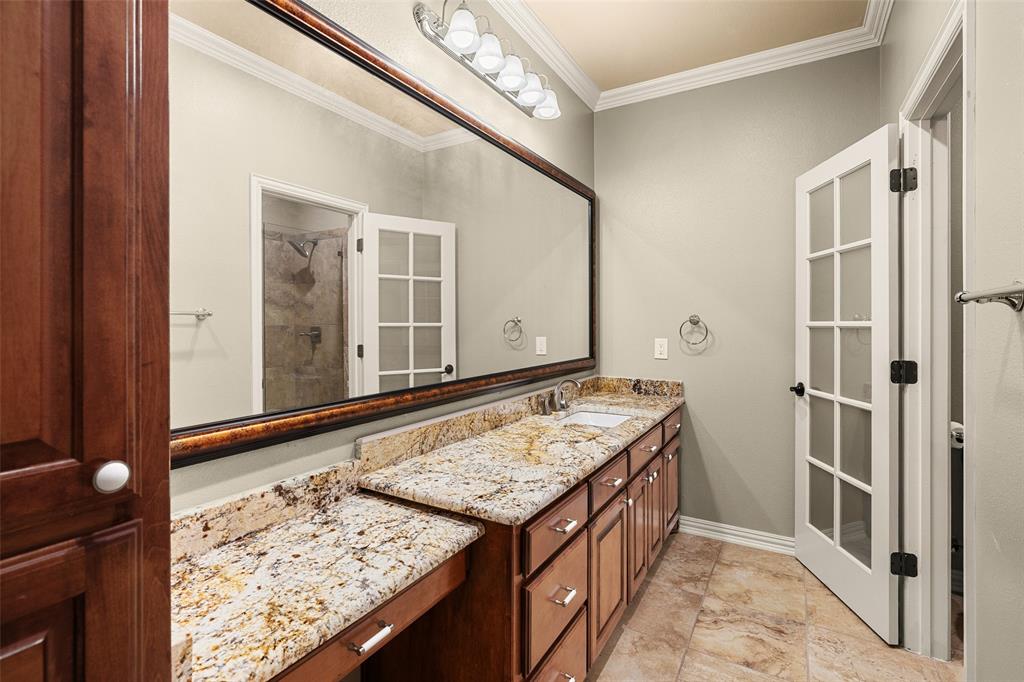 167 Duke Trail Weatherford, TX 76088 - Photo 31 of 40 a bathroom with a granite countertop sink and a mirror