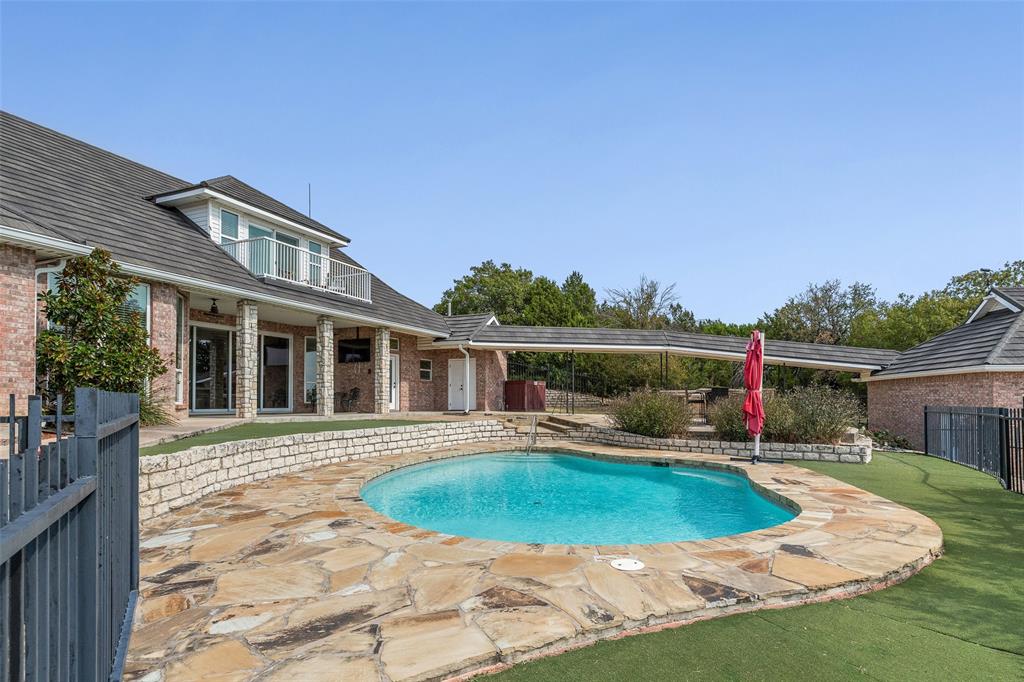 167 Duke Trail Weatherford, TX 76088 - Photo 34 of 40 a view of a house with swimming pool