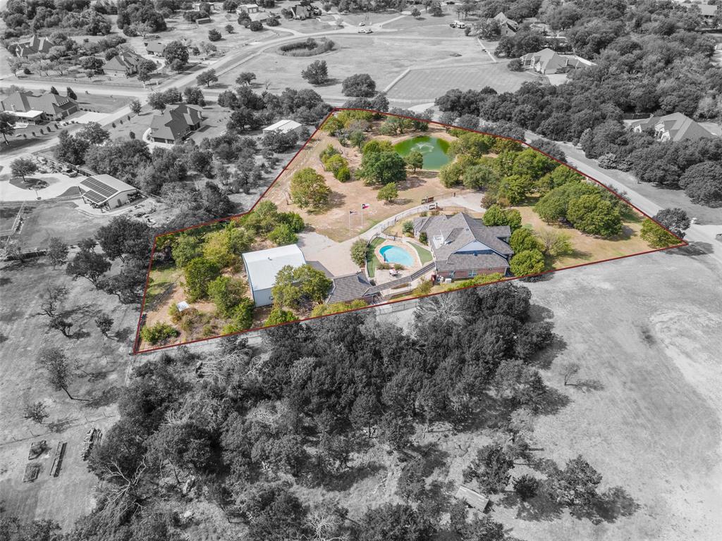 167 Duke Trail Weatherford, TX 76088 - Photo 39 of 40 a aerial view of a house with a yard and large trees