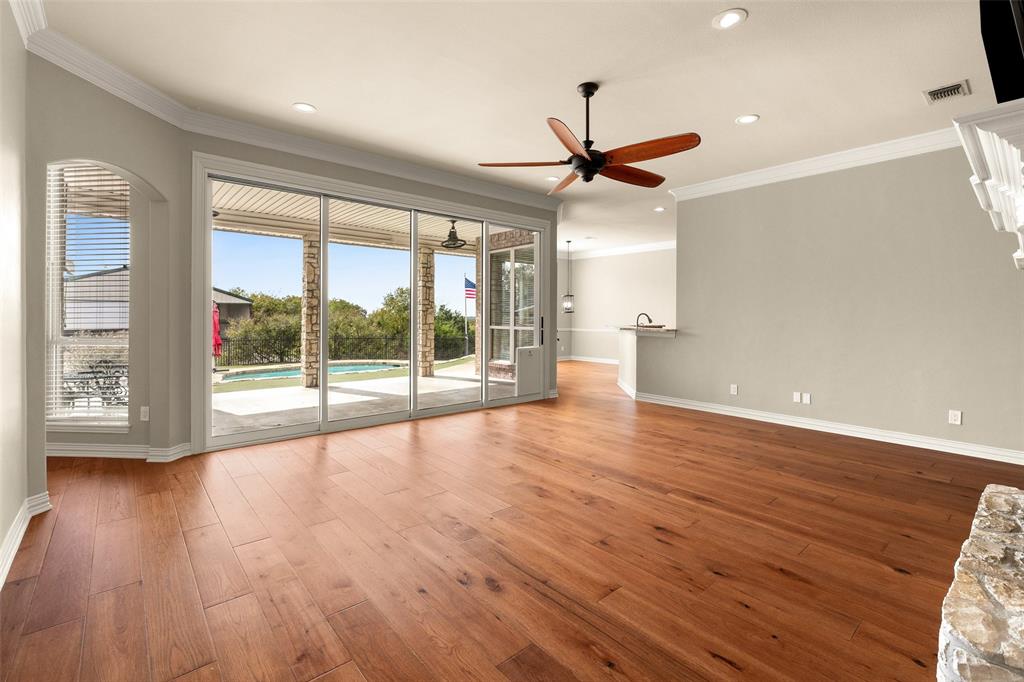 167 Duke Trail Weatherford, TX 76088 - Photo 4 of 40 a view of an empty room with wooden floor and a window