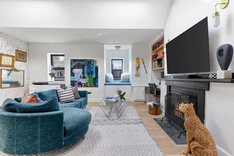 a living room with furniture and a rug