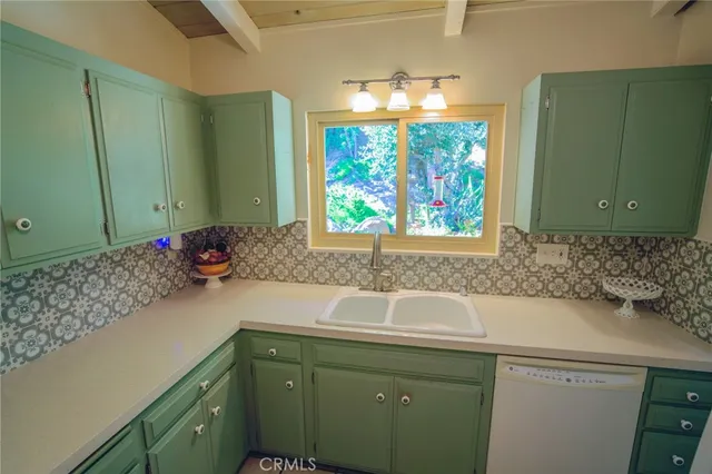 a bathroom with a sink and a large mirror