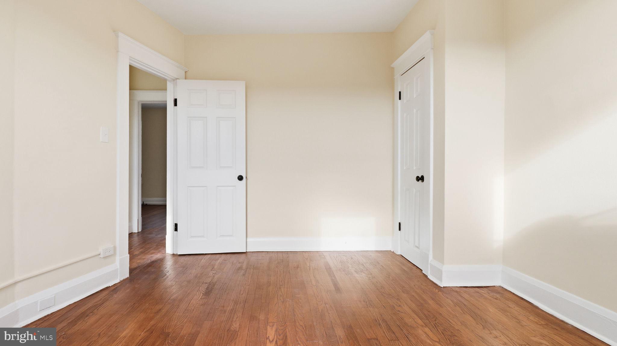 3324 Cliftmont Avenue Baltimore, MD 21213 - Photo 26 of 37 an empty room with wooden floor
