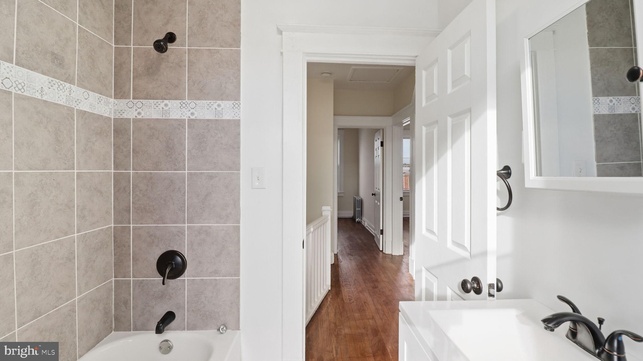 3324 Cliftmont Avenue Baltimore, MD 21213 - Photo 30 of 37 a bathroom with a shower