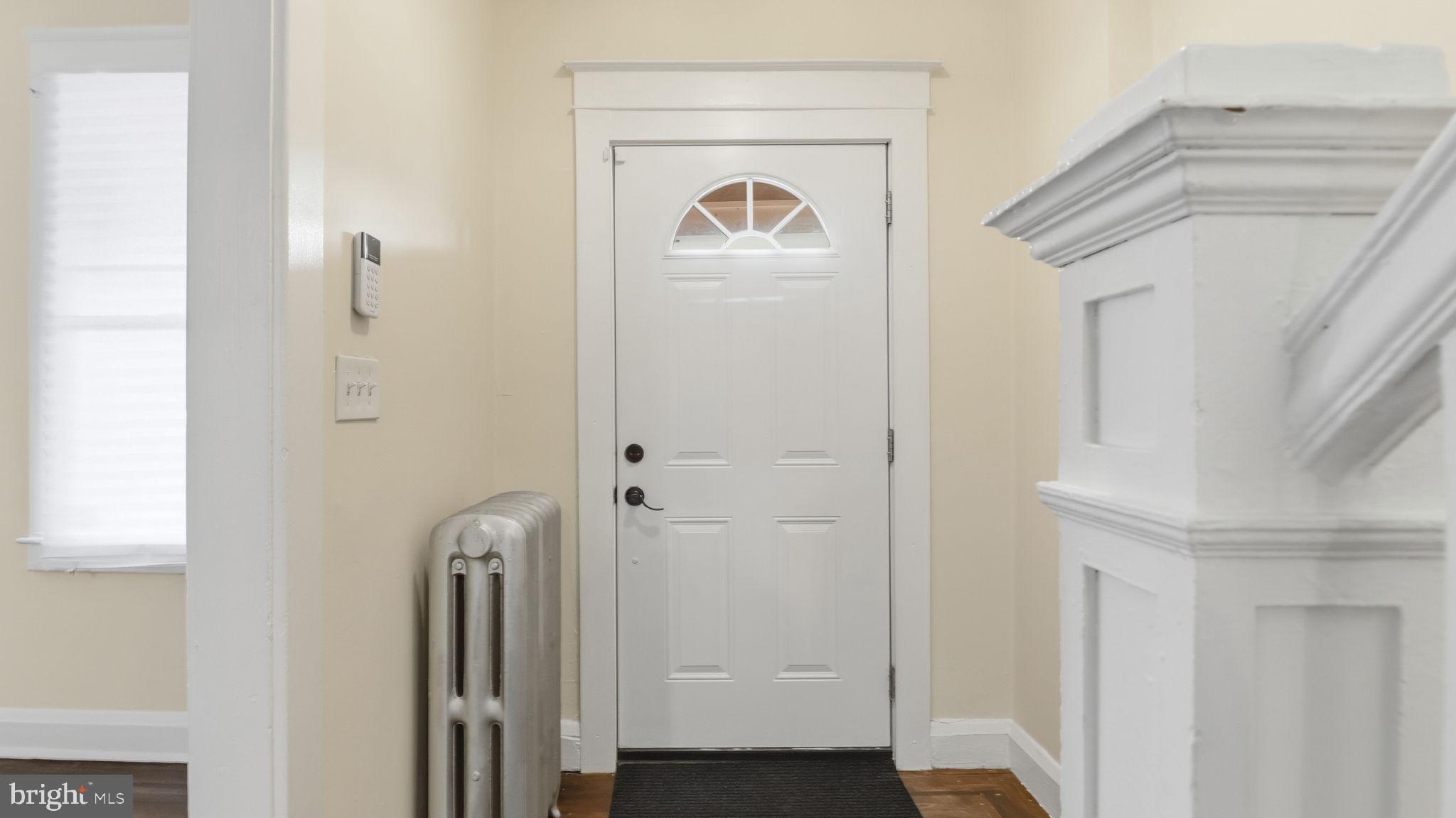 3324 Cliftmont Avenue Baltimore, MD 21213 - Photo 7 of 37 a front view of a house with a door