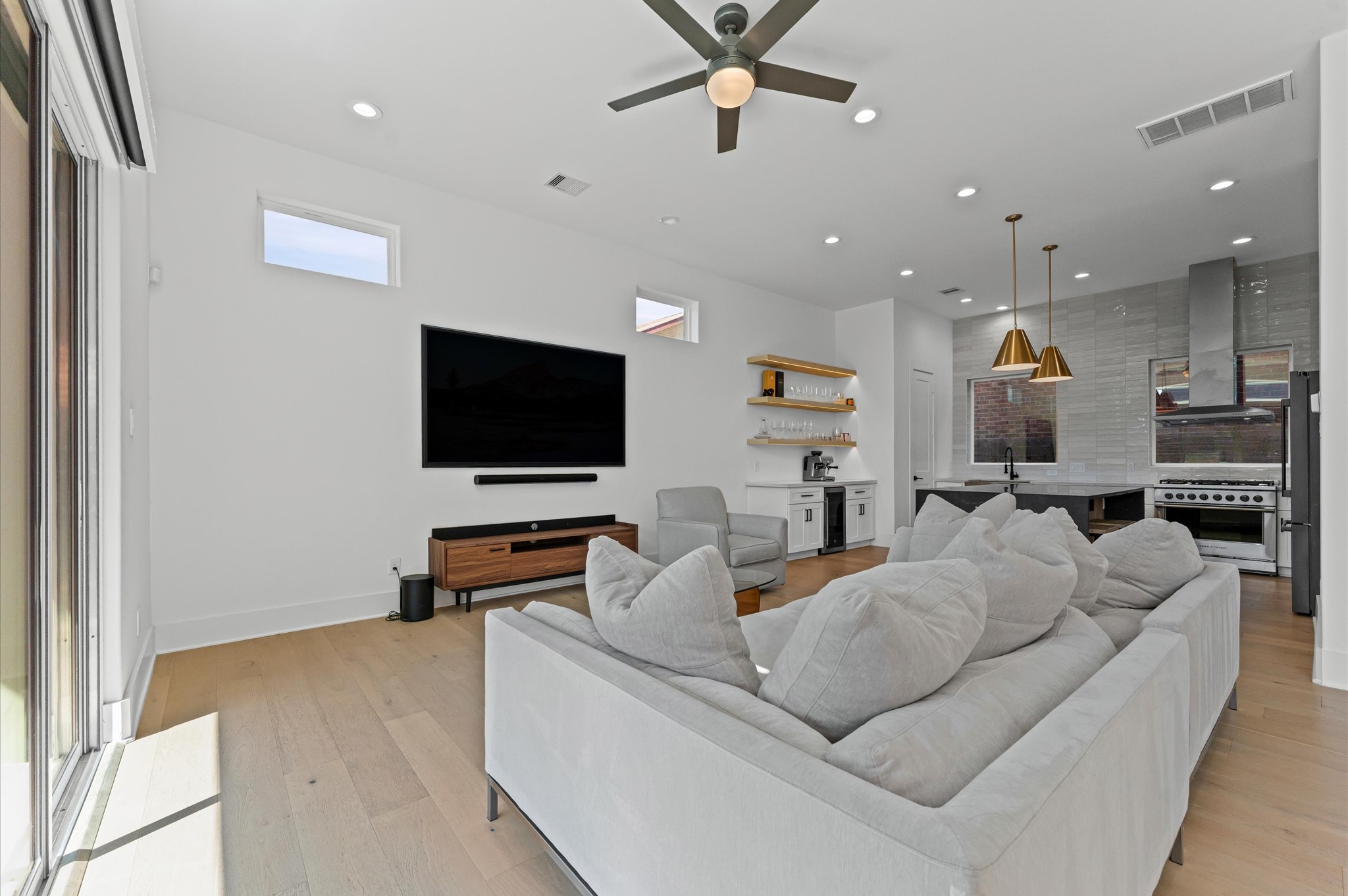 711 Lester Street Houston, TX 77007 - Photo 11 of 39 a living room with furniture and a flat screen tv