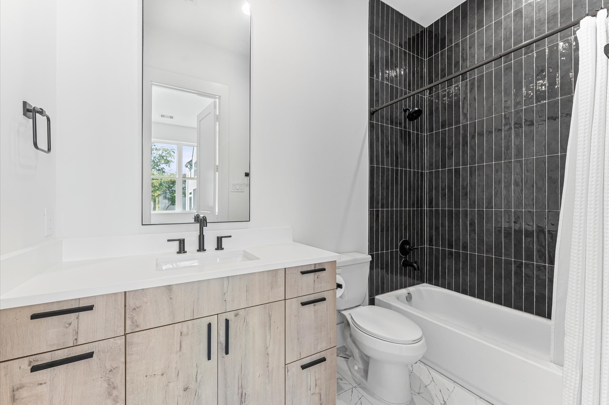 711 Lester Street Houston, TX 77007 - Photo 22 of 39 a bathroom with a sink toilet and shower